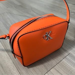 Orange Calvin Klein crossbody bag